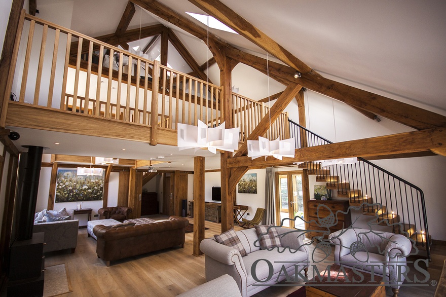 Open plan vaulted space with oak roof structure incorporating oak posts, full or partial oak trusses and oak purlins