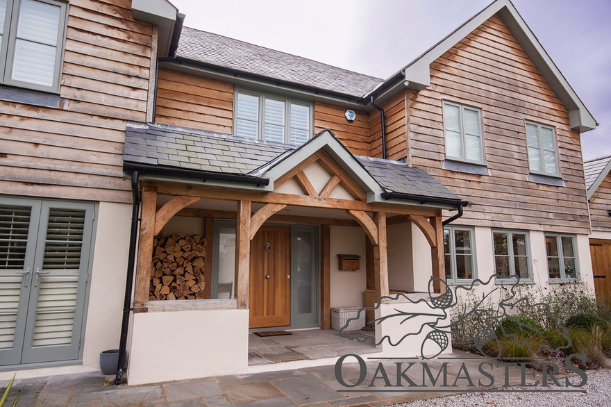At the front, an oak porch connects the old part of the house with the new oak framed extension