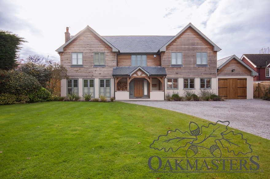 Two storey oak extension on the right doubles the size of the original house