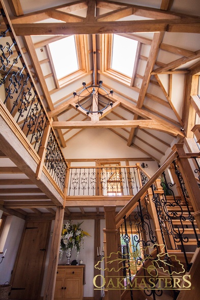 Oak trusses, posts and oak and wrought iron gallery landing just take your breath away 