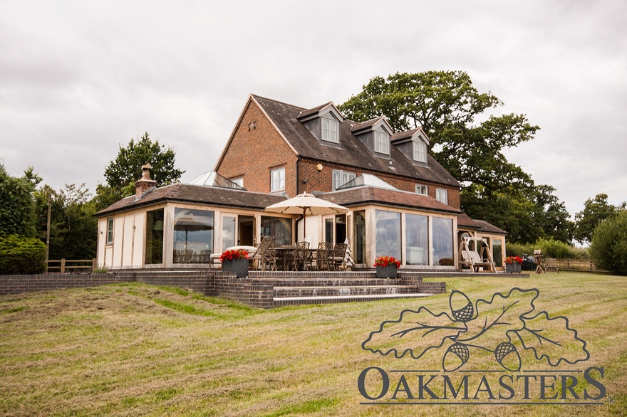 Glazed oak framed extensions at the rear of the house allow for views across the countryside