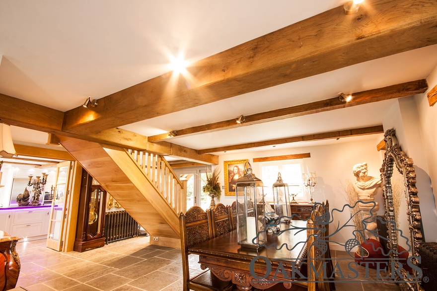 Inside, oak beam covers encase steel joists and add character to the room