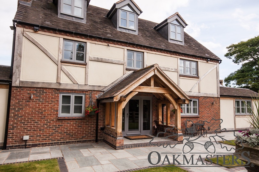 Open oak porch adds character to a modern brick house