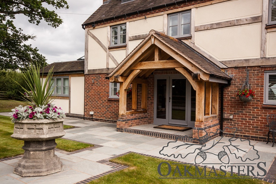 A large open oak porch and oak cladding compliment each other