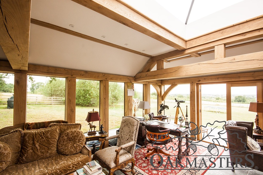 Glazed oak framed walls and a roof lantern flood this office space with light