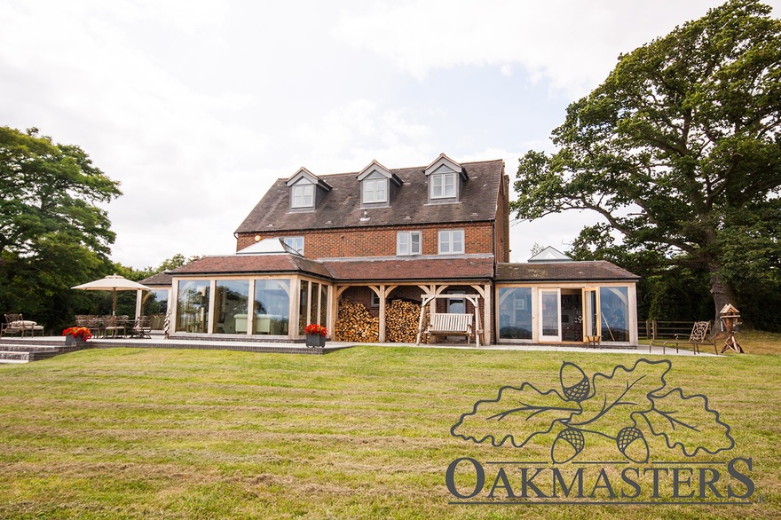 Three glazed oak orangeries and an oak log store copletely changed the character of this house