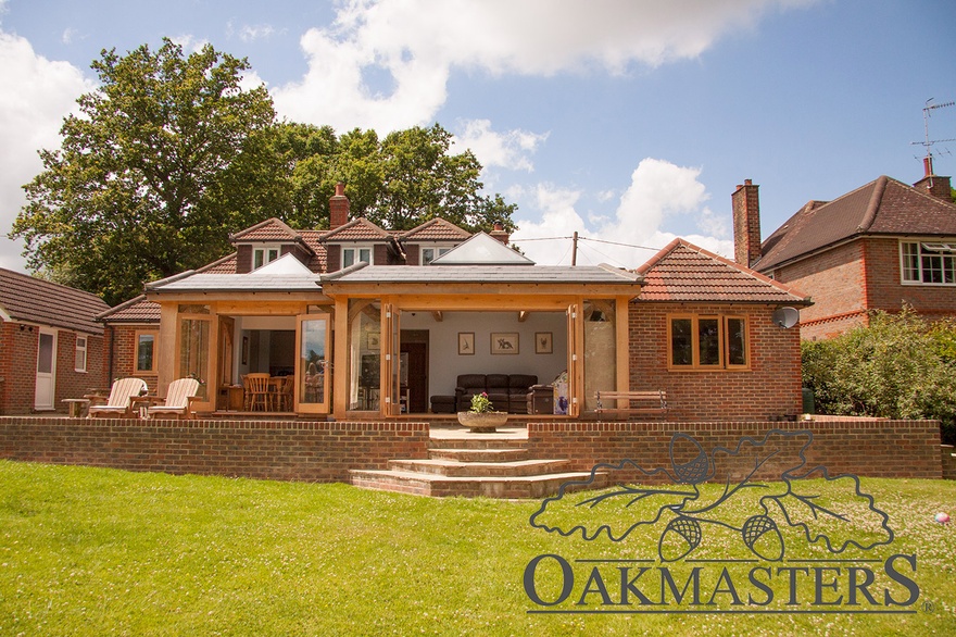 Oak framed organgery spans across two thirds of the width of the house 