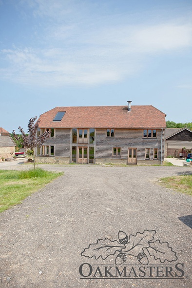 The family home sits in the corner of a large plot adjoining the national park