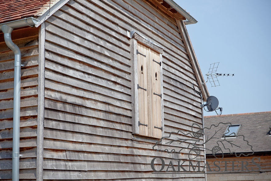 The oak barn has many quirky details such as this lovely pair of window shutters