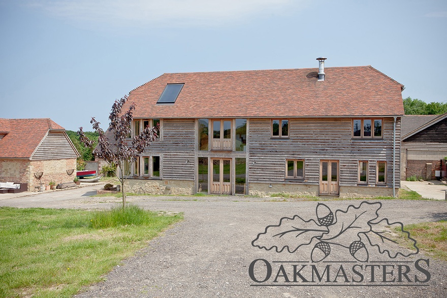 The oak framed barn overlooks open fields