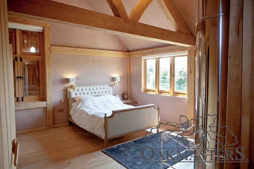 Spare bedroom with a floating queen post truss