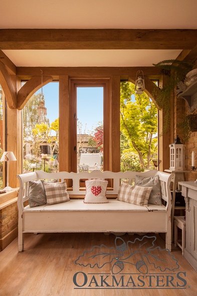 You would probably love to cosy up in the corner of this oak framed extension and enjoy a good book