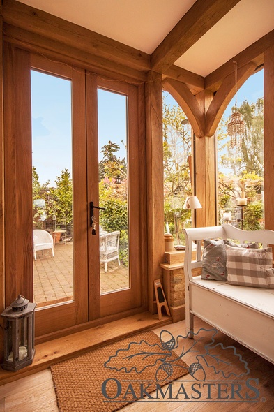 Double oak glazed french doors lead onto a patio