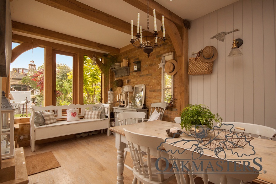 A post and beam structure connects the existing house with the new oak extension