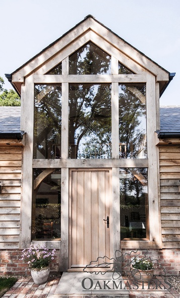 The glazed oak gable porch detail.