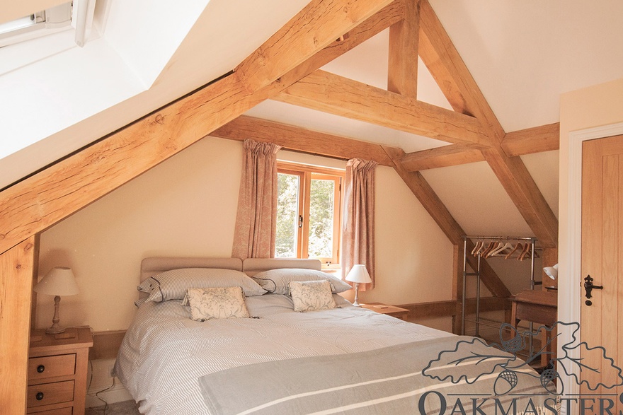 Raised collar oak trusses create additional head height in the bedrooms.