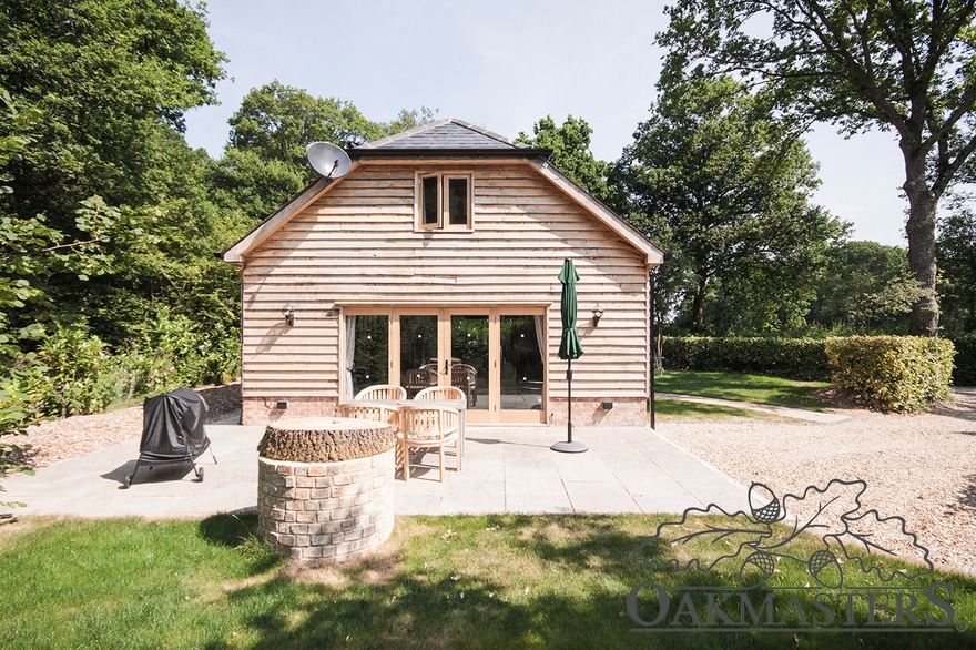 The side of the holiday home opens up with large bifold doors.