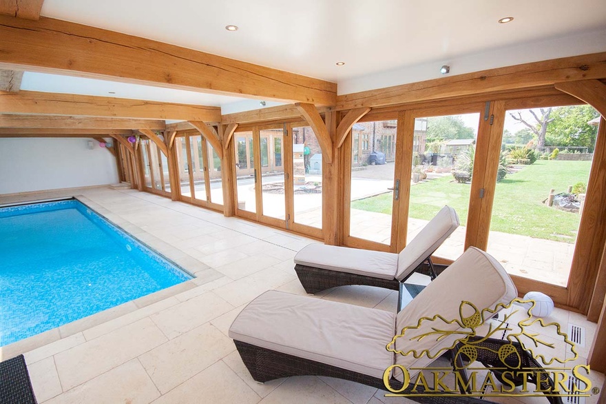 Oak bifold doors can be opened in hot weather for an inside-outside effect