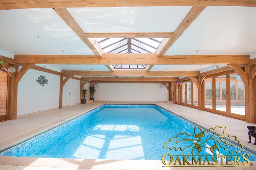 Large oak beams and rafters create an interesting pattern on the ceiling