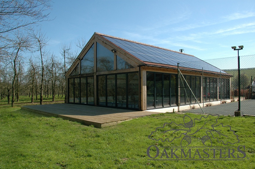 The oak pool house has aluminium bifolds on two sides