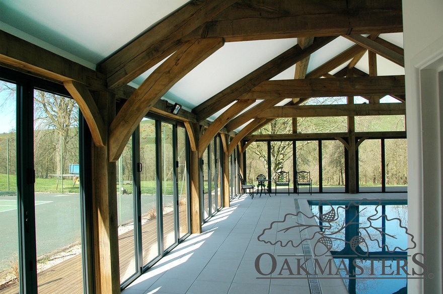 Internal detail of the oak truss, post and bracket connection