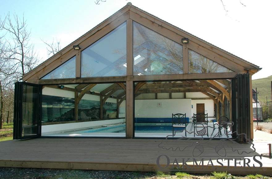 The front bifold doors open the entire front of the swimming pool building