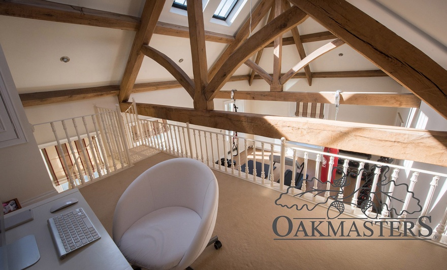 View from a mezzanine office through an oak truss