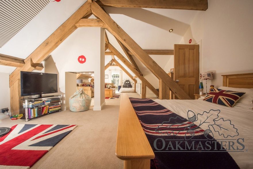 The guest rooms are within the oak roof structure of the pool building