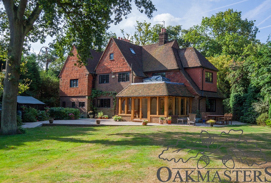 View of the newly added oak orangery from the garden