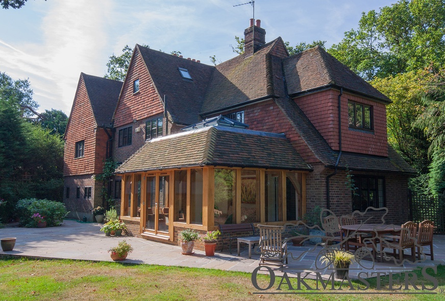 The oak orangery is built onto the right wing of the house and looks like it's always been there