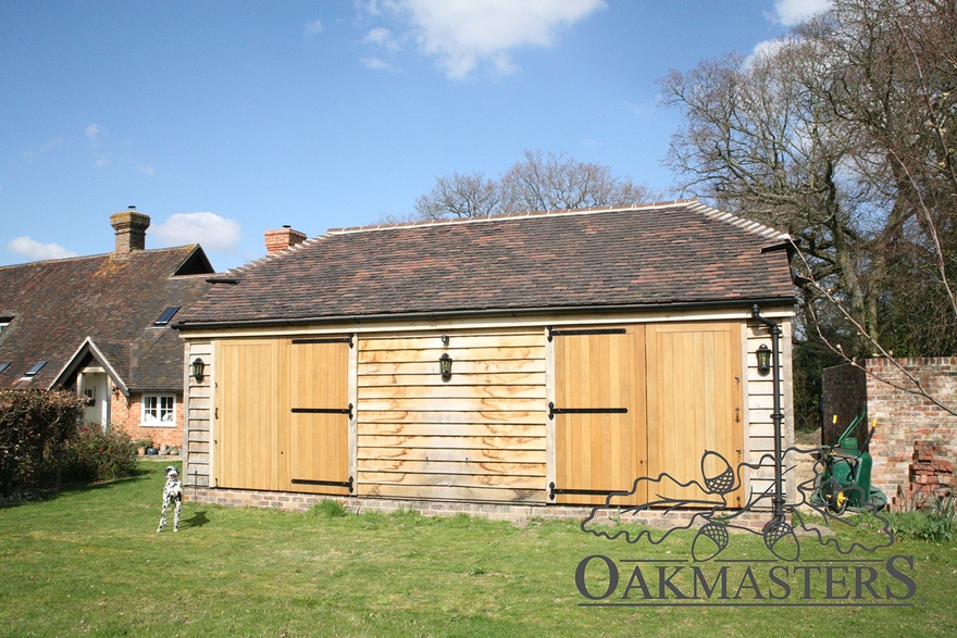 At the back, french doors leading to the garden have oak shutters