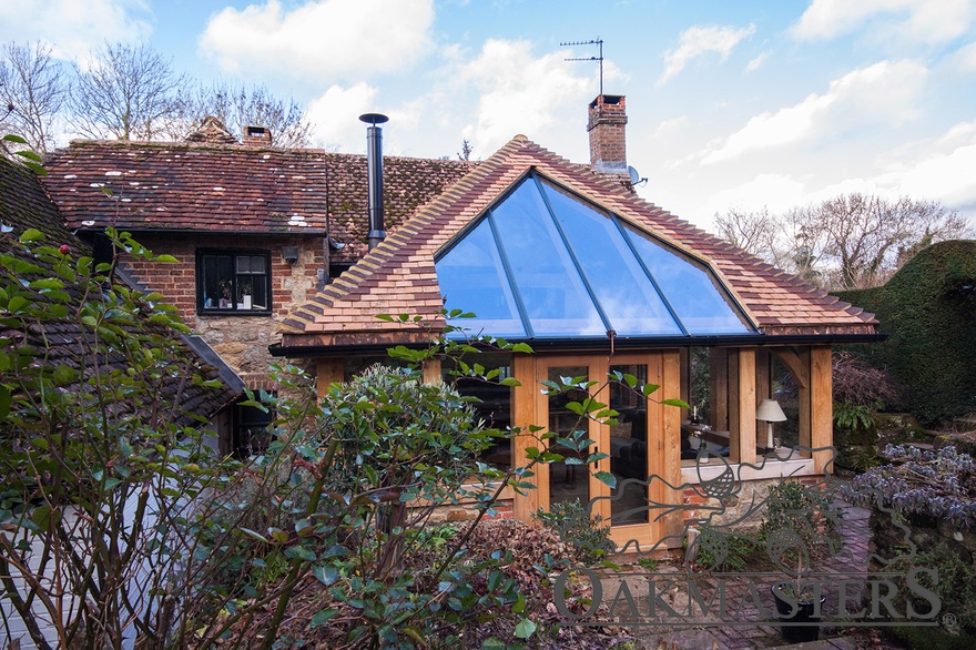 The oak garden room extends a listed property in a sympathetic way